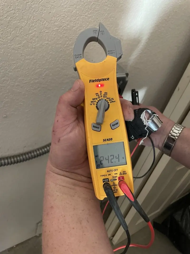 Voltage testing with clamp meter during Generator Installation in Marietta